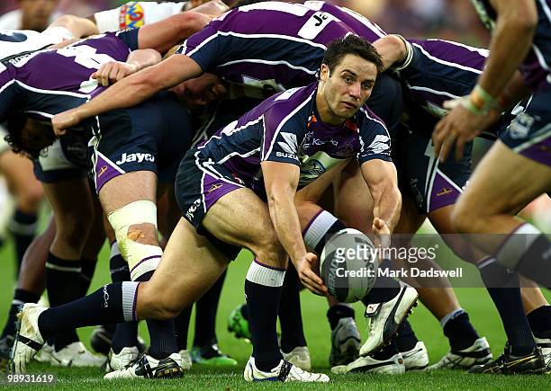 Cooper Cronk of the Storm throws a pass during the round nine NRL match between the Melbourne Storm and the Brisbane Broncos at AAMI Park on May 9,...