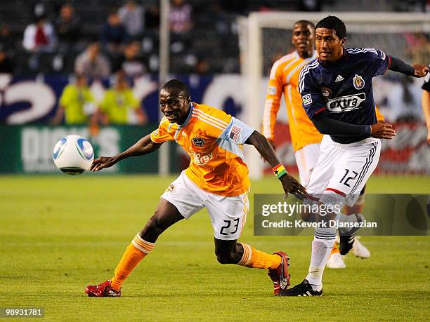 Dominic Oduro of Houston Dynamo in action against Dario Delgado of Chivas USA during the second half of the MLS soccer game on May 8, 2010 at the...