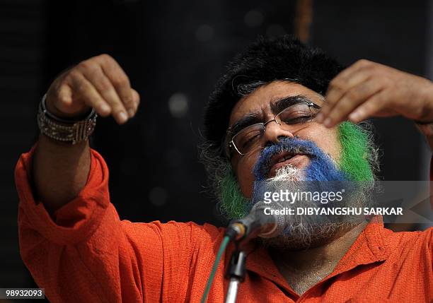 An Indian artist performs at a function organised to celebrate the 150th birth anniversary of poet Rabindranath Tagore in Bangalore on May 9, 2010....