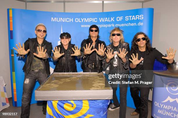 Rudolf Schenker, Klaus Meine, Matthias Jabs, James Kottak and Pawel Maciwoda of Scorpions attending the ceremony for the Munich Olympic Walk Of Stars...