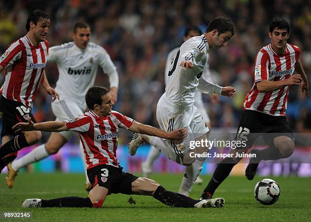 Koikili Lertxundi of Athletic Bilbao tries to stop Gonzalo Higuain of Real Madrid during the La Liga match between Real Madrid and Athletic Bilbao at...