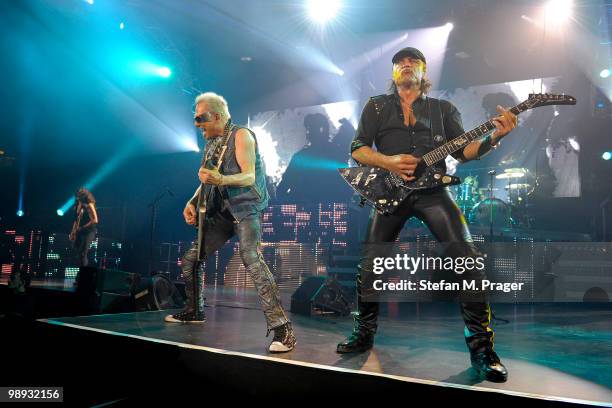 Rudolf Schenker and Matthias Jabs of Scorpions perform on stage at Olympiahalle on May 8, 2010 in Munich, Germany.