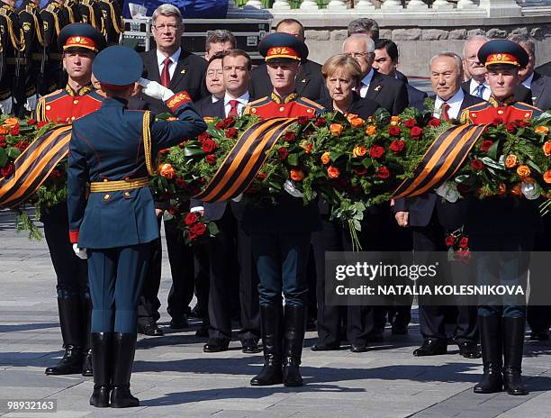 Russian President Dmitry Medvedev, German Chancellor Angela Merkel and other heads of state participate in a wreath-laying ceremony at the Tomb of...
