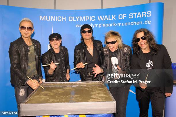 Rudolf Schenker, Klaus Meine, Matthias Jabs, James Kottak and Pawel Maciwoda of Scorpions attending the ceremony for the Munich Olympic Walk Of Stars...