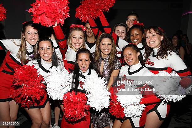 Actress Callie Thorne poses for a photo with St. Johns University cheerleaders at Prom: Class of 2010 at Espace on May 8, 2010 in New York City.