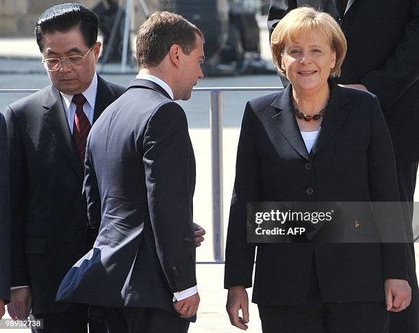 Russian President Dmitry Medvedev , German Chancellor Angela Merkel and Chinese President Hu Jintao take part in a group photo at the Kremlin after...