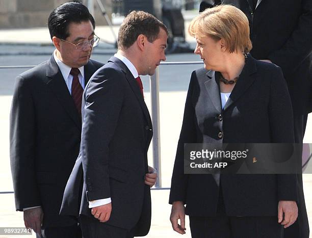 Russian President Dmitry Medvedev , German Chancellor Angela Merkel and Chinese President Hu Jintao take part in a group photo at the Kremlin after...