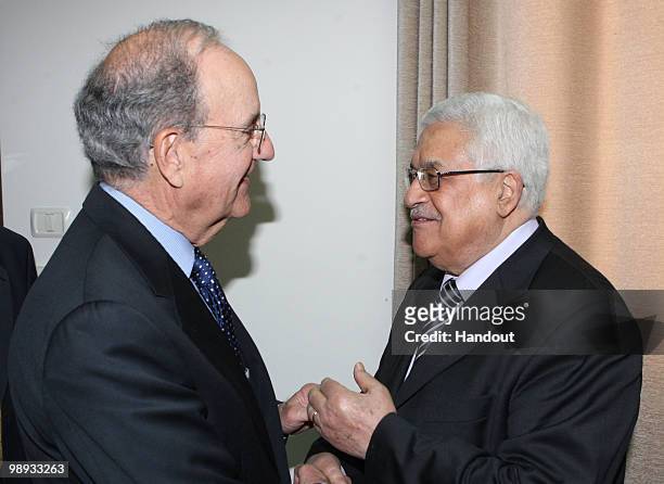 In this handout image from the Palestinian Press Office, Palestinian President Mahmoud Abbas greets U.S. Mideast envoy George Mitchell during their...
