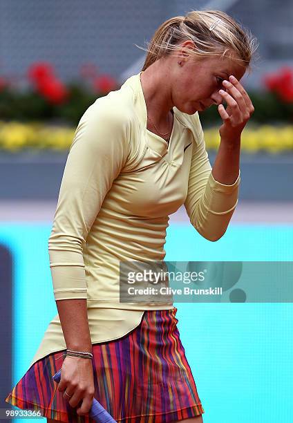 Maria Sharapova of Russia shows her dejection during her straight sets defeat by Lucie Safarova of Czech Republic in their first round match during...