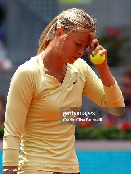 Maria Sharapova of Russia shows her dejection during her straight sets defeat by Lucie Safarova of Czech Republic in their first round match during...