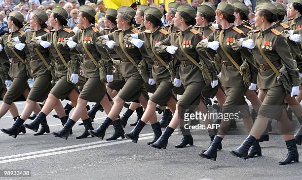 Women wearing World War II Soviet Army uniforms march during a Victory Day military parade in Kiev on May 9, 2010 to mark the 65th anniversary of the...