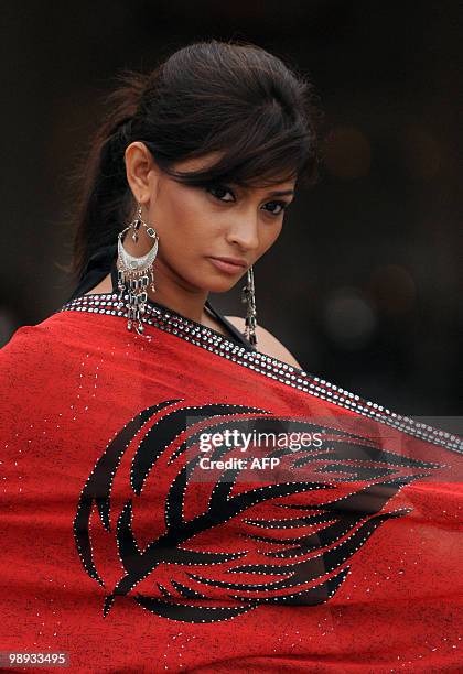 Sri Lankan model displays a creation by local Sri Lankan designers during a fashion event in Colombo on May 9, 2010. Clothing accounts for over half...