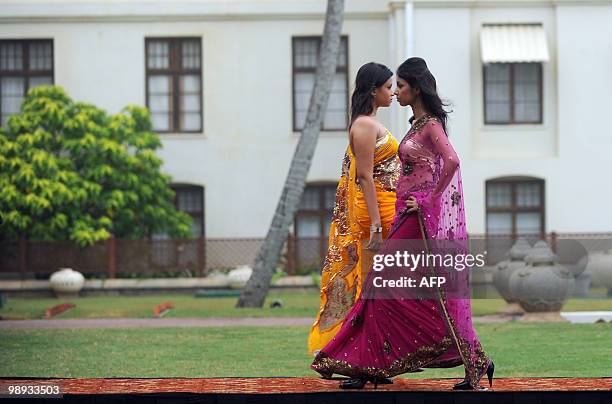 Sri Lankan models displays creations by local Sri Lankan designers during a fashion event in Colombo on May 9, 2010. Clothing accounts for over half...