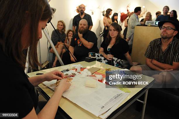 Taxidermy artist Jeanie M demonstrates how to skin and taxidermy a mouse at the Rogue Taxidermy Show at the La Luz de Jesus Gallery in Los Angeles on...