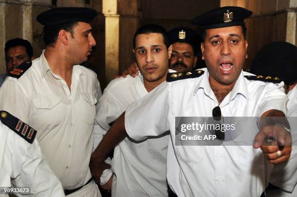 Egyptian Mahmud Essawi , a suspect in the murder of Moroccan singer Leila Ghofran's daughter, arrives to attend a hearing in his retrial at a court...