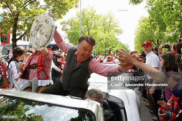 Louis van Gaal , head coach of Bayern Muenchen and manager Christian Nerlinger celebrate the German championship with the trophy on the way to the...