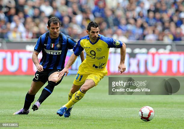 Dejan Stankovic of FC Internazionale Milano competes for the ball with Sergio Pellissier of AC Chievo Verona during the Serie A match between FC...