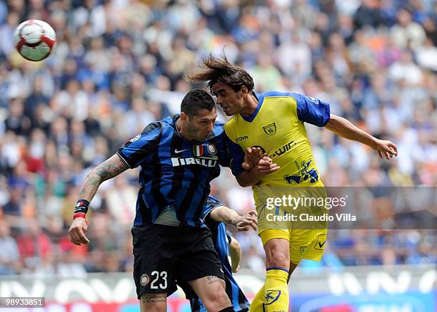 Marco Materazzi of FC Internazionale Milano competes for the ball with Pablo Granoche of AC Chievo Verona during the Serie A match between FC...