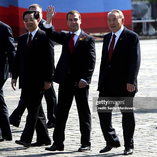 Chinese President Hu Jintao, Russian President Dmitry Medvedev, Kazakh President Nursultan Nazarbayev leave after attending the Victory Day parade on...