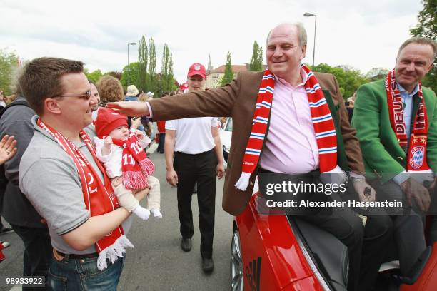 Uli Hoeness , president of Bayern Muenchen and Karl-Heinz Rummenigge , CEO of Bayern Muenchen celebrate the German championship on the way to the...