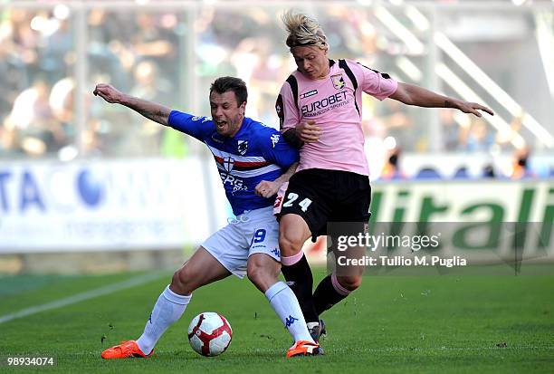 Antonio Cassano of Sampdoria and Simon Kjaer of Palermo compete for the ball during the Serie A match between US Citta di Palermo and UC Sampdoria at...
