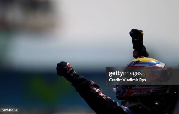 Mark Webber of Australia and Red Bull Racing celebrates in parc ferme after winning the Spanish Formula One Grand Prix at the Circuit de Catalunya on...