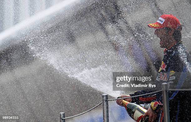 Mark Webber of Australia and Red Bull Racing celebrates on the podium after winning the Spanish Formula One Grand Prix at the Circuit de Catalunya on...