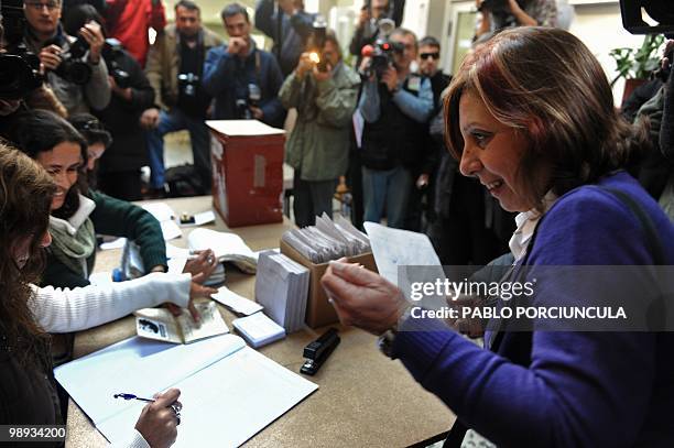 Ana Olivera , mayoral candidate for the Frente Amplio ruling party, casts her vote during the country's municipal elections, in Montevideo on May 9,...