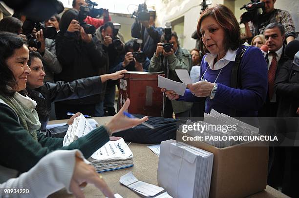 Ana Olivera , mayoral candidate for the Frente Amplio ruling party, casts her vote during the country's municipal elections, in Montevideo on May 9,...