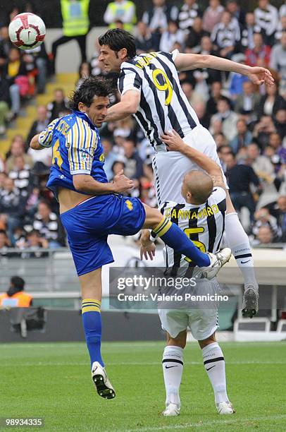 Vincenzo Iaquinta of Juventus FC clashes with Alessandro Lucarelli of Parma FC during the Serie A match between Juventus FC and Parma FC at Stadio...