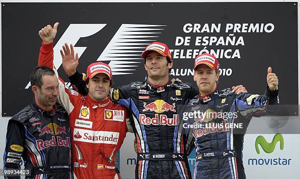 Red Bull's German driver Sebastian Vettel, Red Bull's Australian driver Mark Webber and Ferrari's Spanish driver Fernando Alonso pose on the podium...