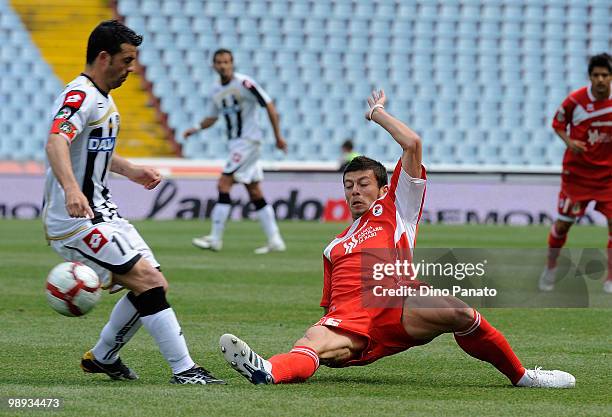 Antonio Di Natale of Udinese competes with Massimo Donati of Bari during the Serie A match between Udinese Calcio and AS Bari at Stadio Friuli on May...