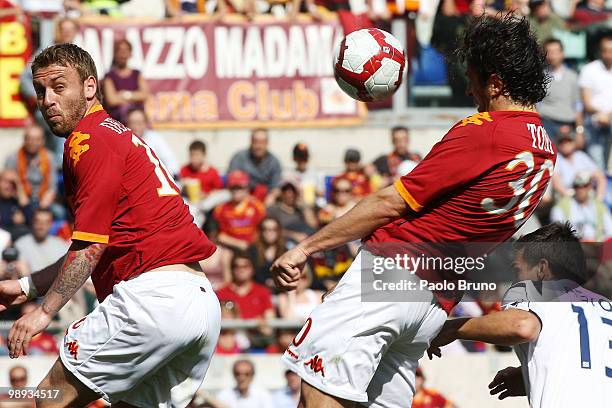 Daniele De Rossi and Luca Toni of AS Roma in action during the Serie A match between AS Roma and Cagliari Calcio at Stadio Olimpico on May 9, 2010 in...