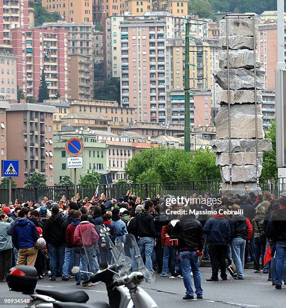 Fans of Genoa CFC gather outside the stadium under the monument where Claudio Spagnolo, a fan of Genoa CFC, was killed by a fan of AC Milan 15 years...