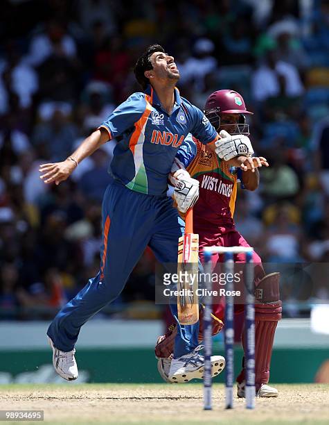 Ashish Nehra of India collides with Shivnarine Chanderpaul of West Indies during the ICC World Twenty20 Super Eight match between West Indies and...