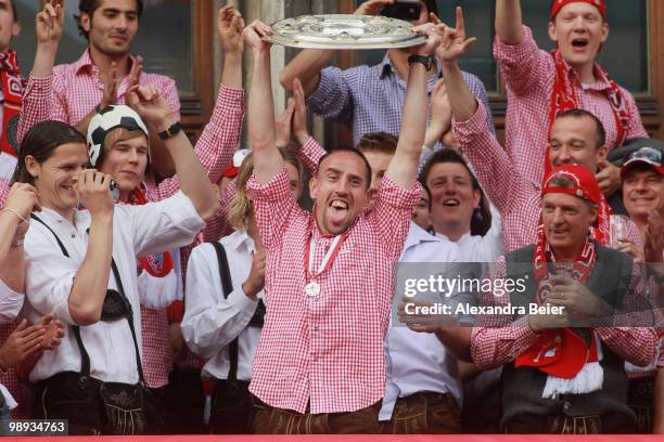 Franck Ribery and his team mates of Bayern Muenchen celebrate their German championship title on the balcony of the town hall on May 9, 2010 in...