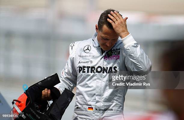 Michael Schumacher of Germany and Mercedes GP walks in parc ferme following the Spanish Formula One Grand Prix at the Circuit de Catalunya on May 9,...