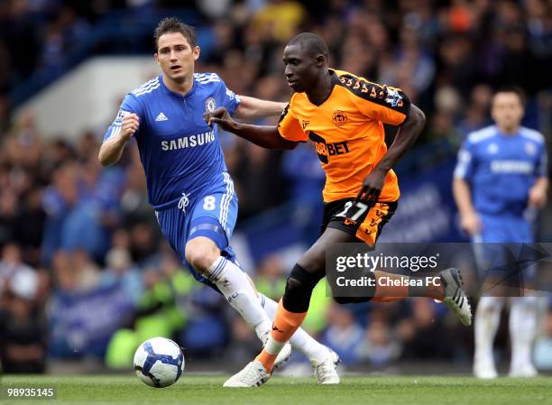 Mohamed Diame of Wigan is closed down by Frank Lampard of Chelsea during the Barclays Premier League match between Chelsea and Wigan Athletic at...