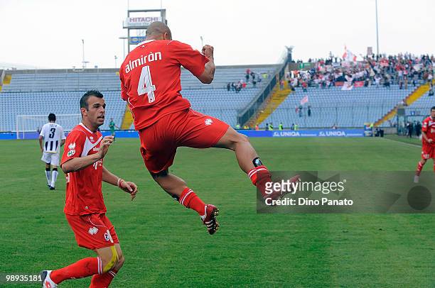 Bernardo Sergio Almiron of Bari celebrates after scoring with teammate Riccardo Meggiorini during the Serie A match between Udinese Calcio and AS...