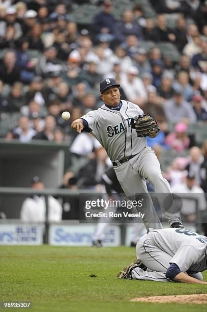 Jose Lopez of the Seattle Mariners makes an off balance throw against the Chicago White Sox on April 24, 2010 at U.S. Cellular Field in Chicago,...