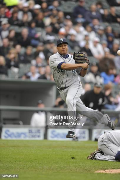 Jose Lopez of the Seattle Mariners makes an off balance throw against the Chicago White Sox on April 24, 2010 at U.S. Cellular Field in Chicago,...