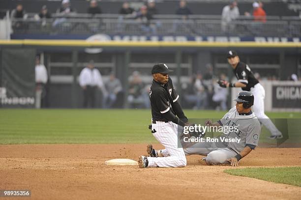 Alexei Ramirez of the Chicago White Sox can't catch the ball as Jose Lopez of the Seattle Mariners steals second base on April 24, 2010 at U.S....