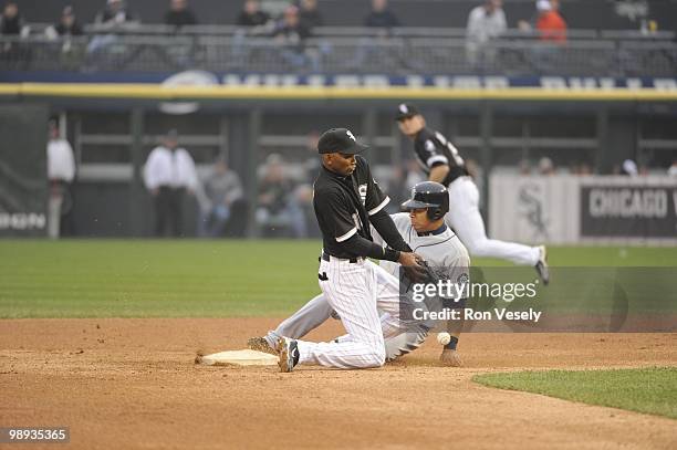 Alexei Ramirez of the Chicago White Sox can't catch the ball as Jose Lopez of the Seattle Mariners steals second base on April 24, 2010 at U.S....