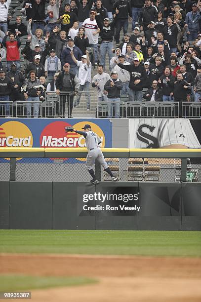 Eric Byrnes of the Seattle Mariners leaps but cannot catch the ball hit by Alexei Ramirez of the Chicago White Sox during the fifth inning on April...