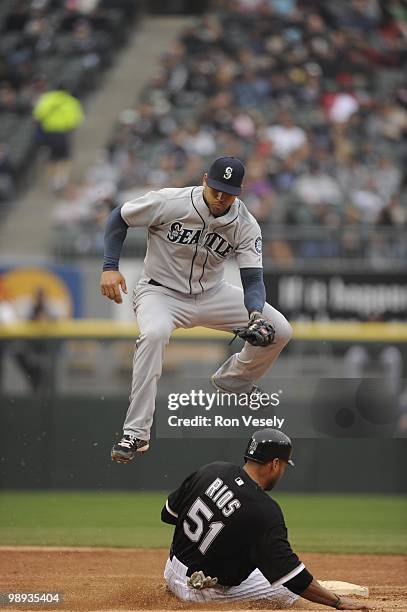 Alex Rios of the Chicago White Sox steals second base under the tag of Matt Tuiasosopo of the Seattle Mariners on April 24, 2010 at U.S. Cellular...