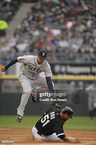 Alex Rios of the Chicago White Sox steals second base under the tag of Matt Tuiasosopo of the Seattle Mariners on April 24, 2010 at U.S. Cellular...