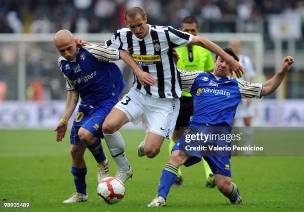 Giorgio Chiellini of Juventus FC competes for the ball with Valiani Francesco and Alessandro Lucarelli of Parma FC during the Serie A match between...