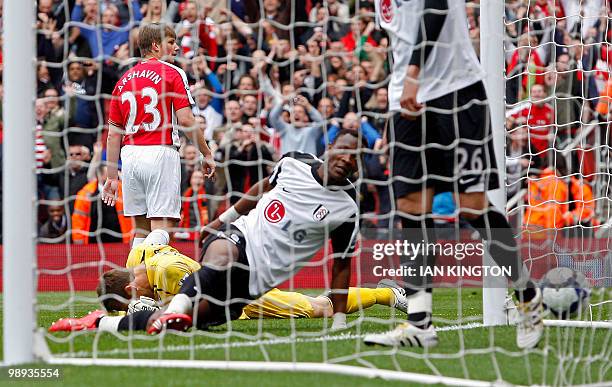 Arsenal's Russian striker Andrey Arshavin celebrates scoring the opening goal of the English Premier League football match between Arsenal and Fulham...