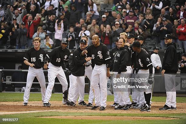 The White Sox gather at home plate to greet Alex Rios of the Chicago White Sox after Rios hit a walk-off, two-run home run against David Aardsma of...