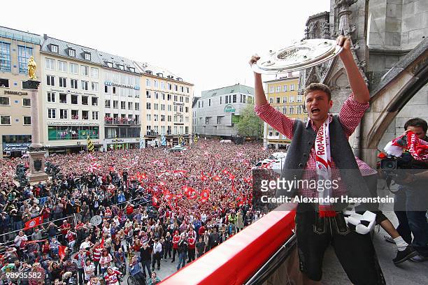 Thomas Mueller of Bayern Muenchen celebrates the German championship title on the balcony of the town hall on May 9, 2010 in Munich, Germany.